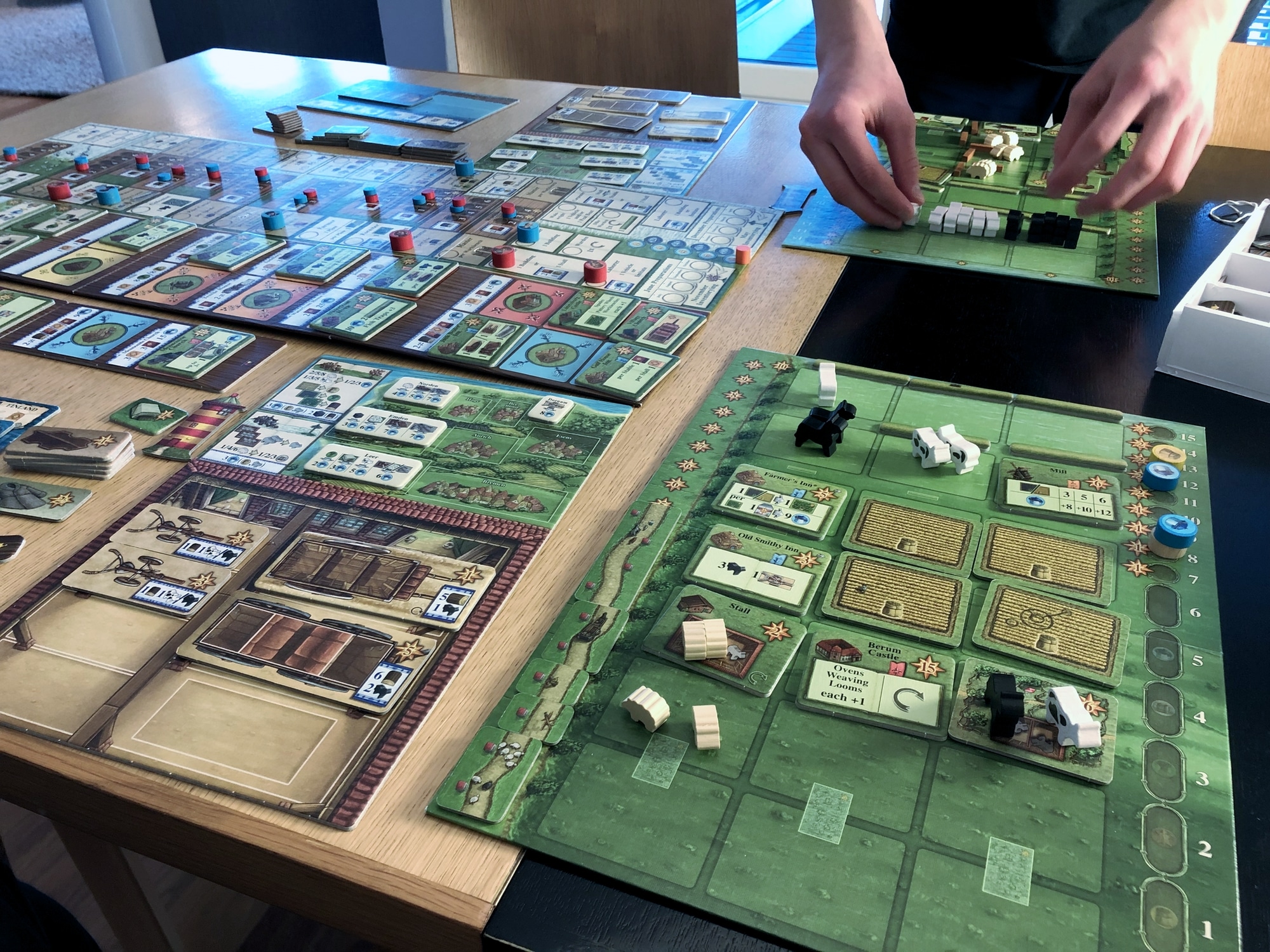 Fields of Arle player boards and the center board