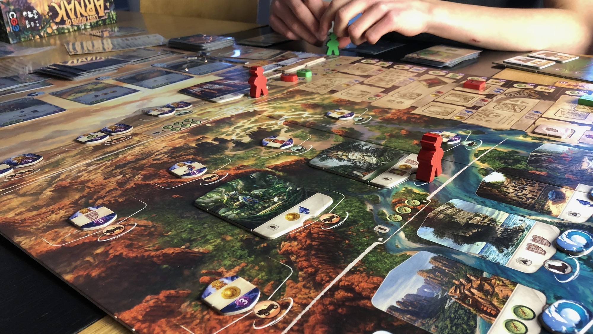 Arnak board with meeples