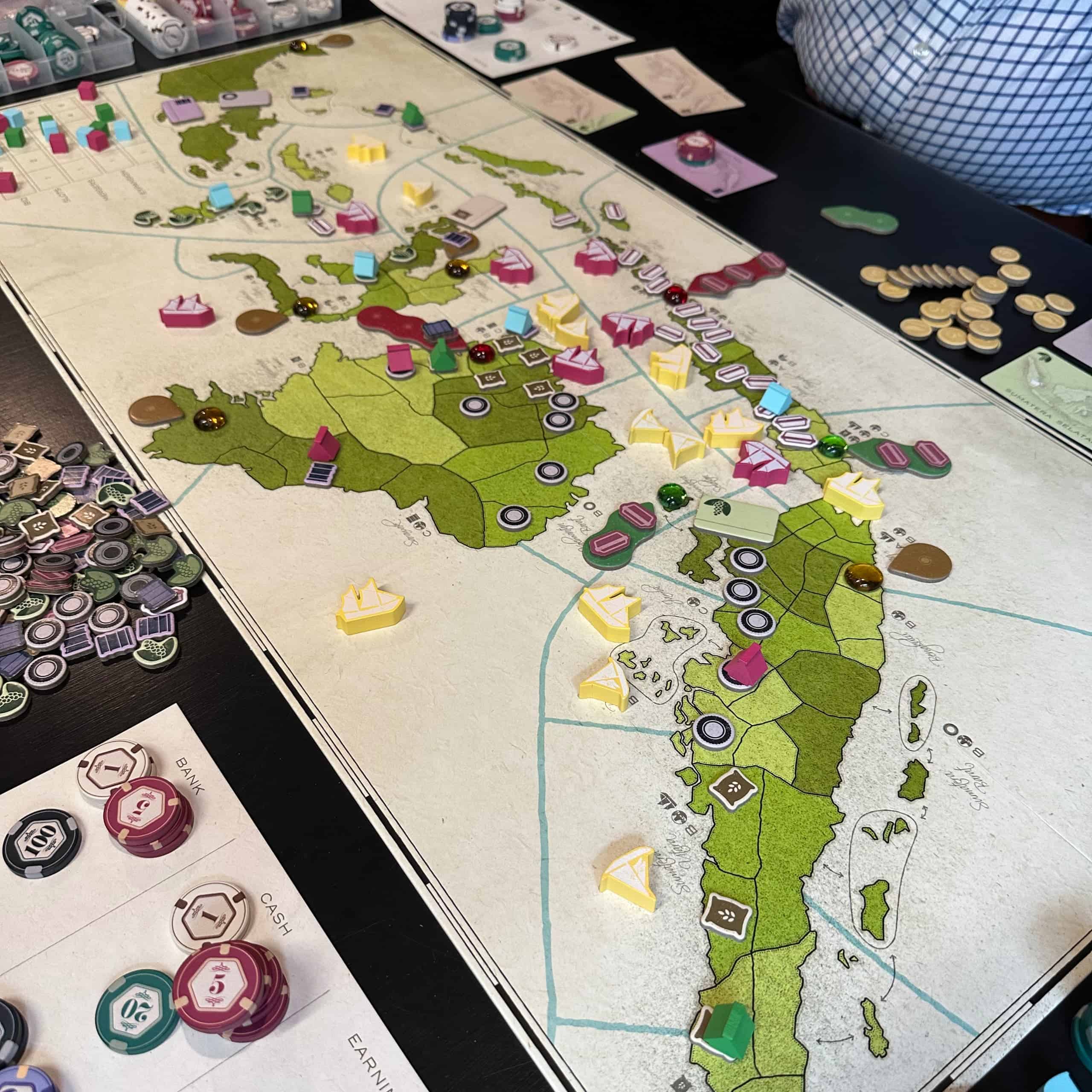 Indonesia board, with a three-player game going on. Java is full of Siap Saji, Sumatra and Borneo have large rubber plantations, Halmahera has spice.